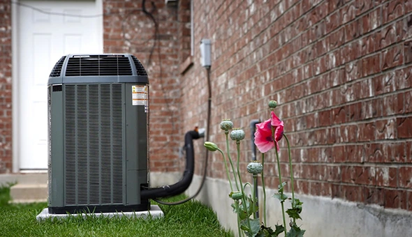 HVAC technician installing new system in Odessa, TX.