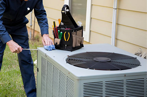HVAC technician installing a new central AC unit in Lubbock, TX.